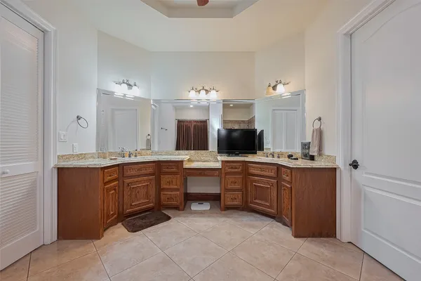 a large bathroom with a sink vanity and mirror