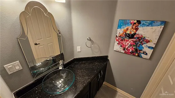 a bathroom with a sink a double vanity and a mirror