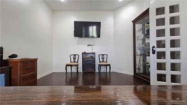 a view of a dining room with furniture and chandelier