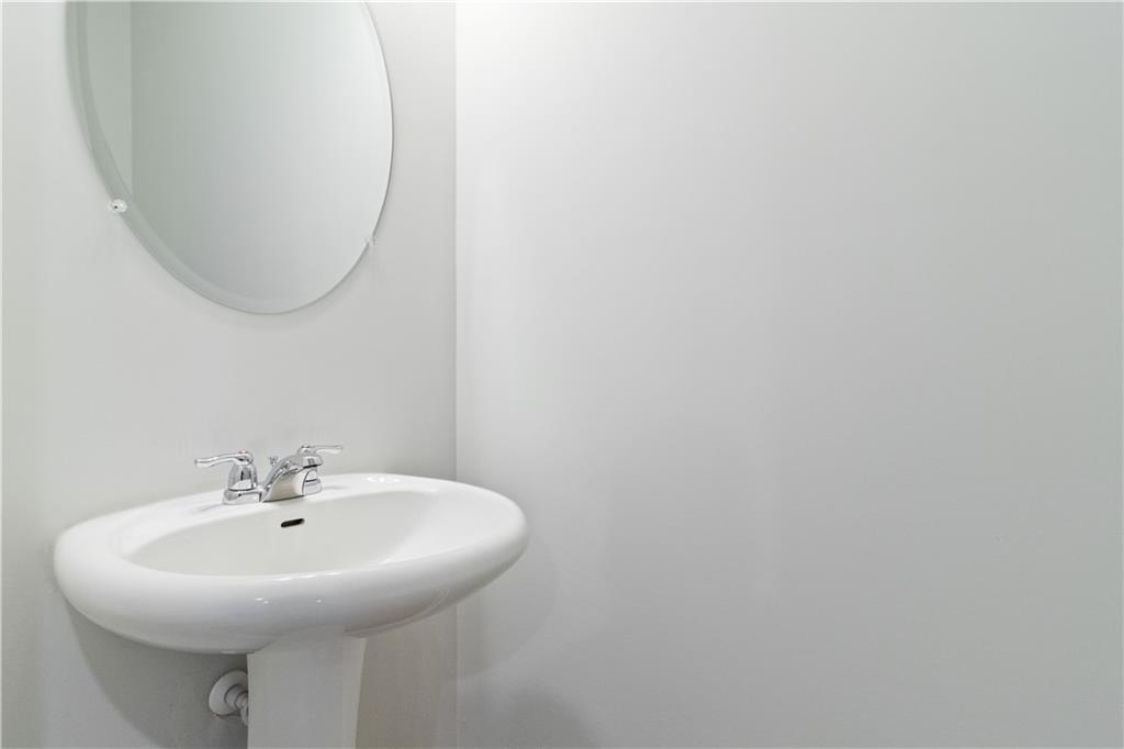 5113 Sidney Sq Drive Flowery Branch, GA 30542 - Photo 12 of 35 a sink with a mirror and a vanity