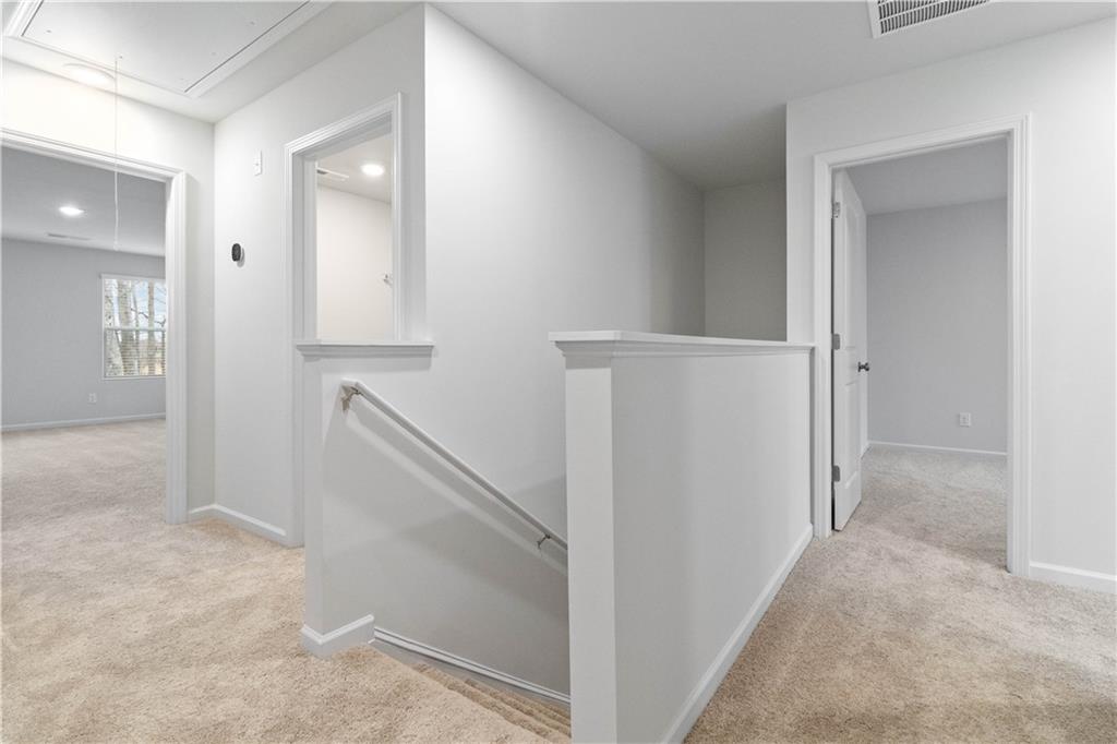 5113 Sidney Sq Drive Flowery Branch, GA 30542 - Photo 18 of 35 a view of a hallway with hallway and stairs