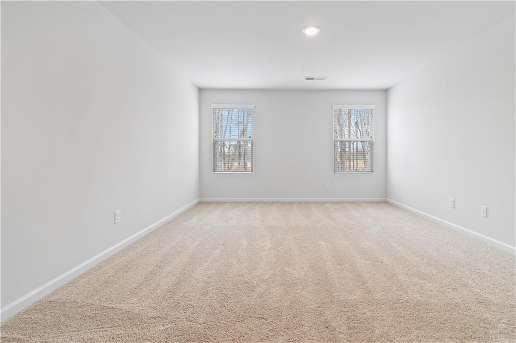 5113 Sidney Sq Drive Flowery Branch, GA 30542 - Photo 20 of 35 an empty room with windows
