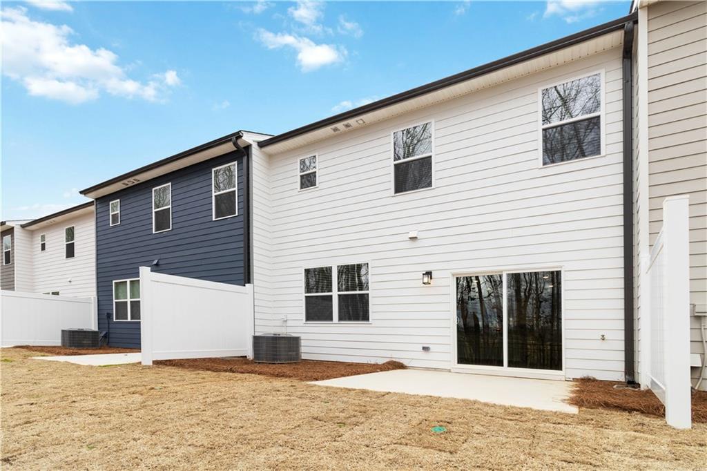 5113 Sidney Sq Drive Flowery Branch, GA 30542 - Photo 32 of 35 a view of a house with a house in the background