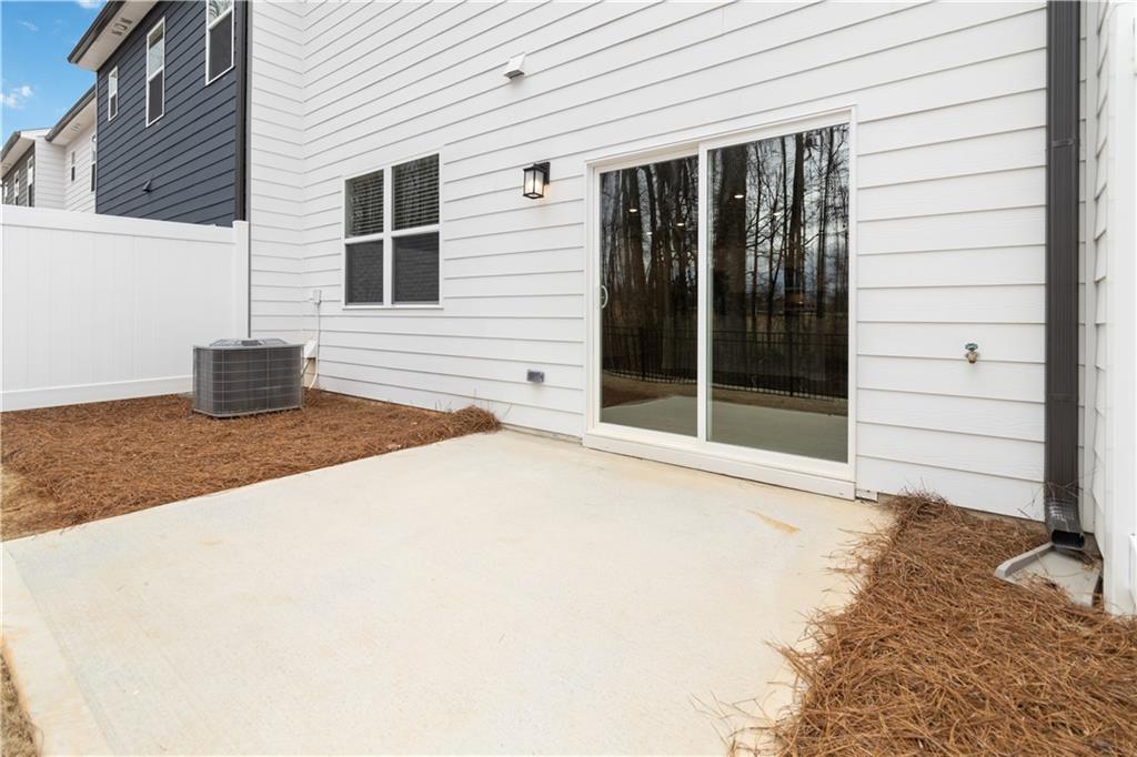 5113 Sidney Sq Drive Flowery Branch, GA 30542 - Photo 34 of 35 a house with a large window