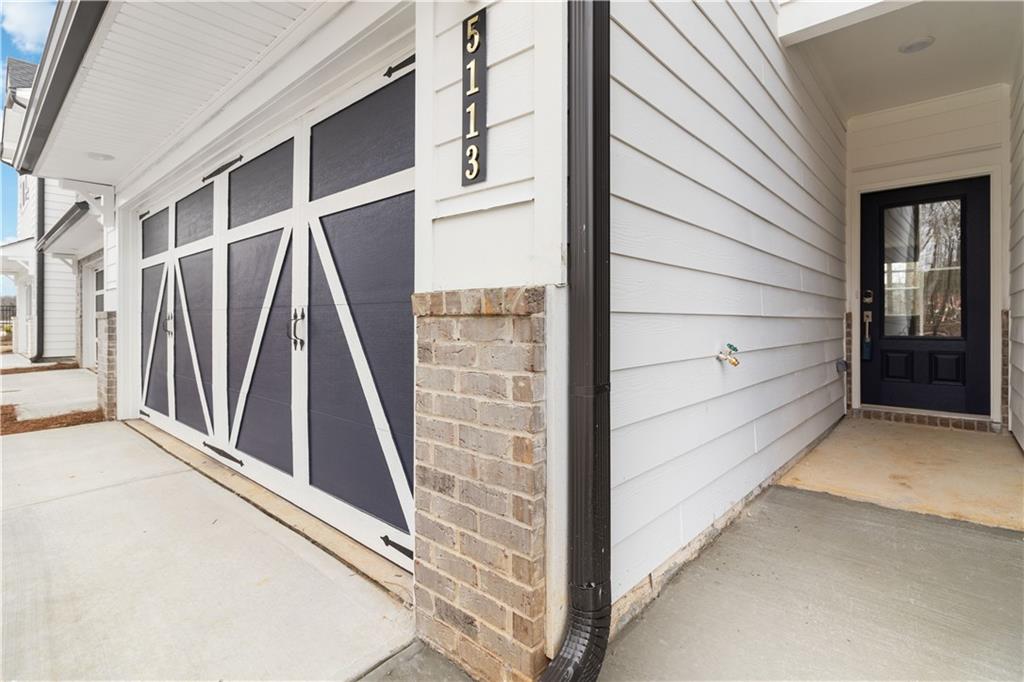 5113 Sidney Sq Drive Flowery Branch, GA 30542 - Photo 4 of 35 a view of front door