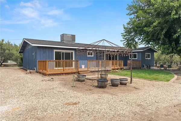 a view of a house with a wooden fence