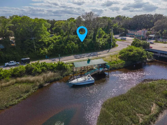 a view of a backyard with plants and a garden