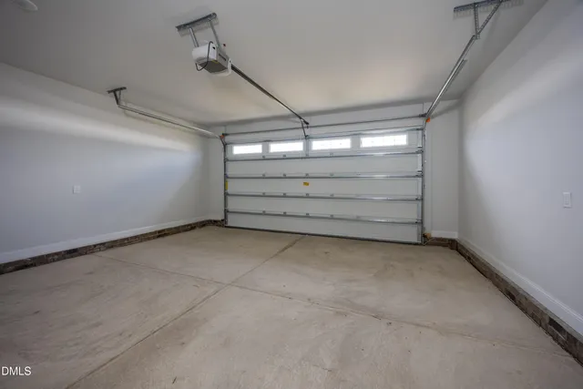a kitchen with granite countertop cabinets and white appliances