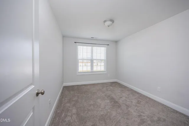 a view of a hallway with two rooms