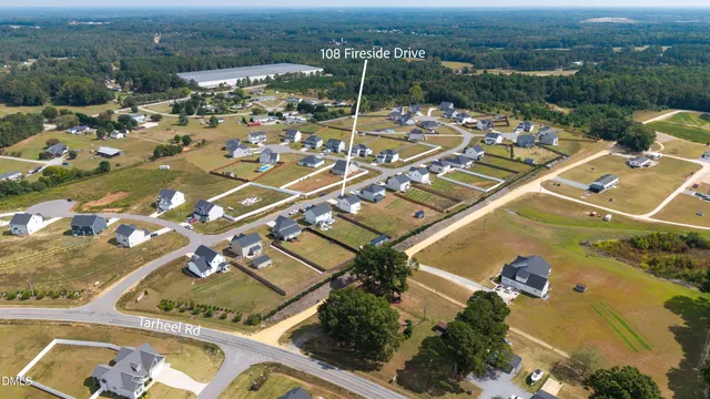 an aerial view of a house with a swimming pool