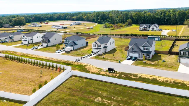 a view of swimming pool with outdoor seating space
