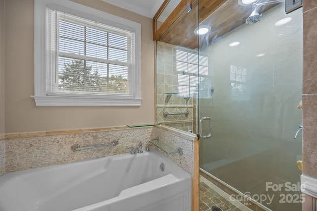 a white bath tub sitting next to a shower