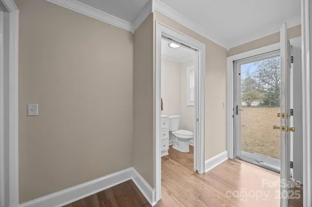 a view of a bathroom with a toilet and a shower