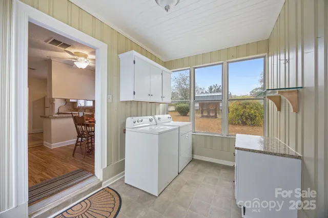 a room with a bed and a dresser