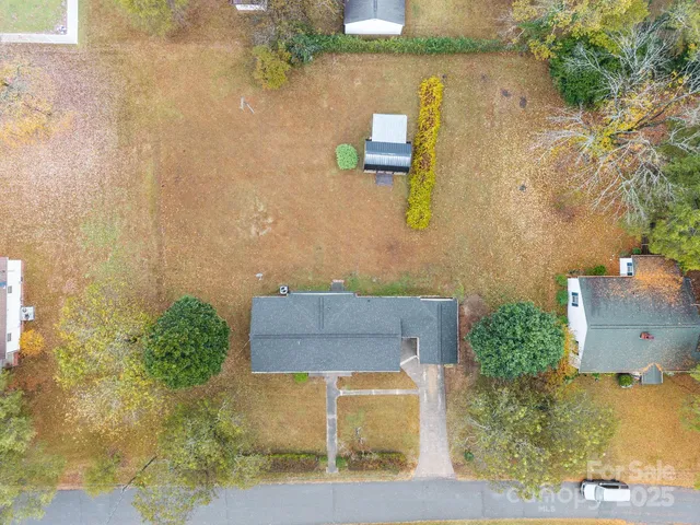 aerial view of a house with a yard