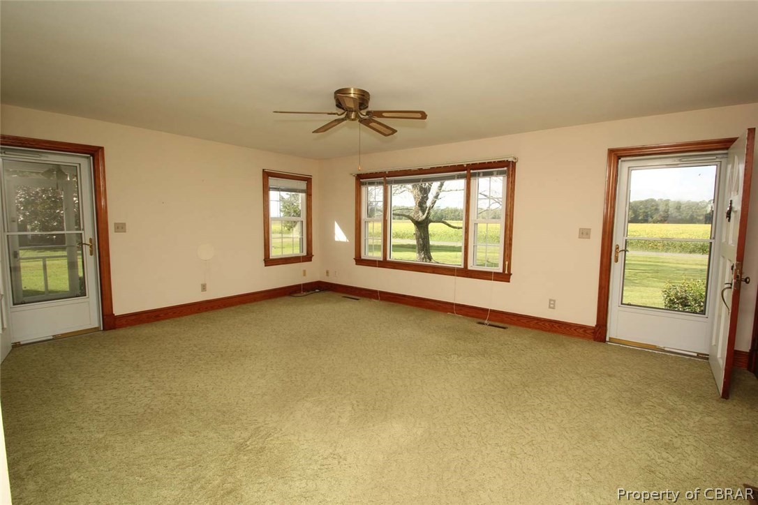 1818 Chownings Ferry Road Lancaster, VA 22503 - Photo 12 of 29 Large Living Room with great natural light, 2 storm doors one going to front entrance and one going to screen porch