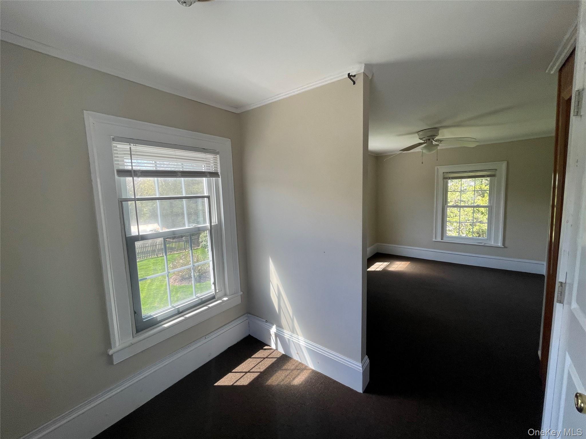 496 North Country Road St. James, NY 11780 - Photo 11 of 18 an empty room with windows