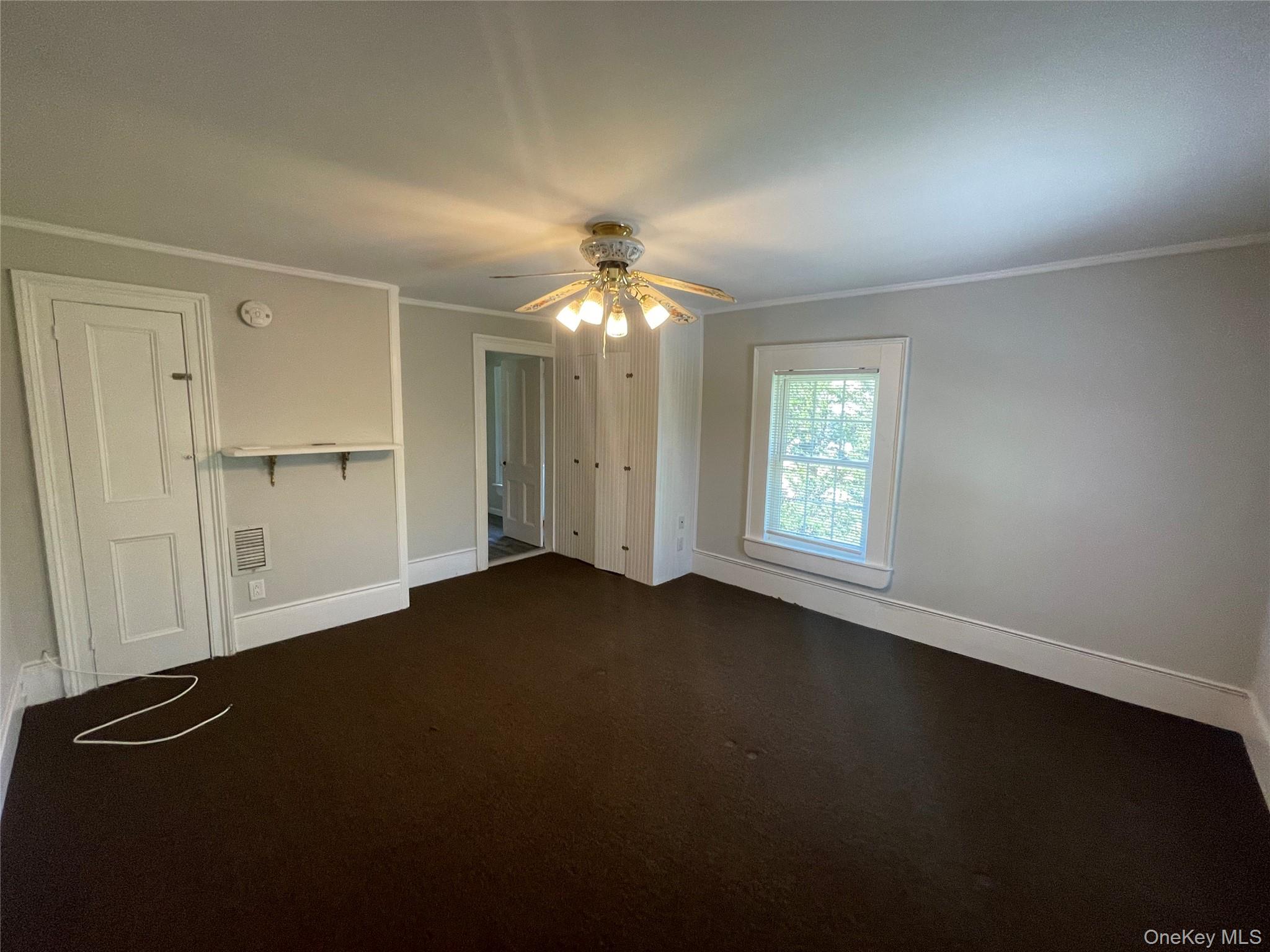 496 North Country Road St. James, NY 11780 - Photo 13 of 18 wooden floor in an empty room with a window