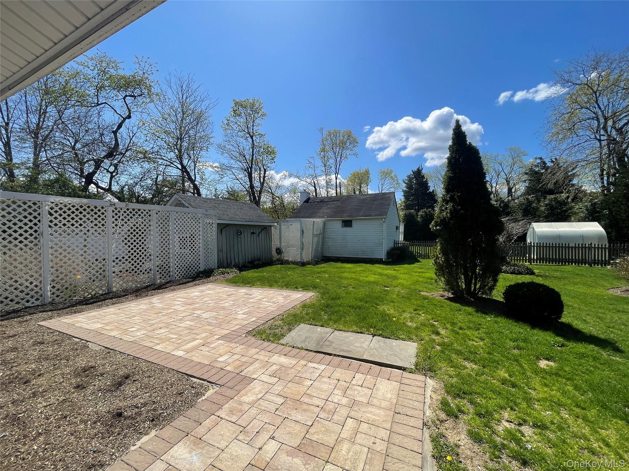 496 North Country Road St. James, NY 11780 - Photo 15 of 18 a view of a backyard of the house