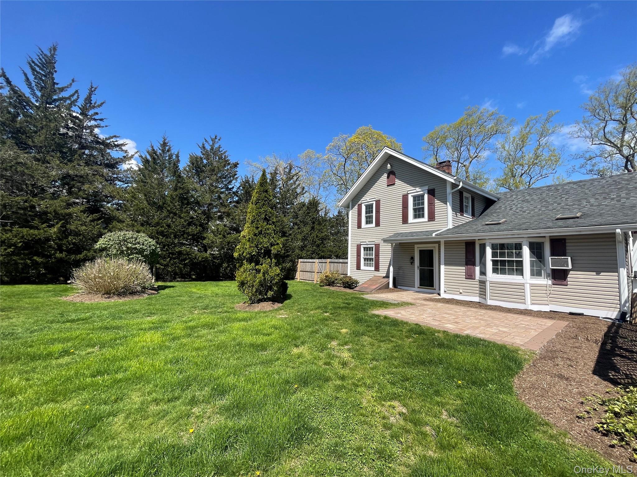 496 North Country Road St. James, NY 11780 - Photo 16 of 18 a house view with a garden space