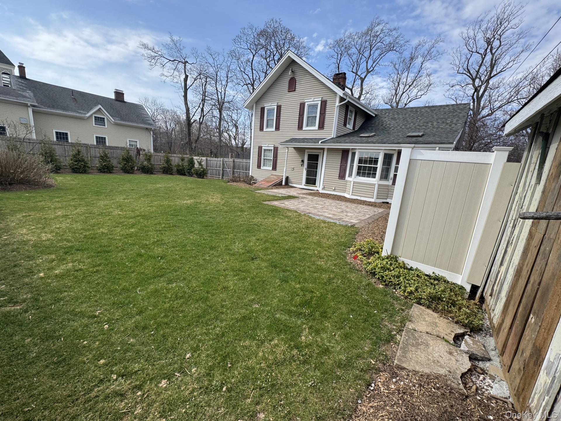 496 North Country Road St. James, NY 11780 - Photo 17 of 18 a view of house with yard