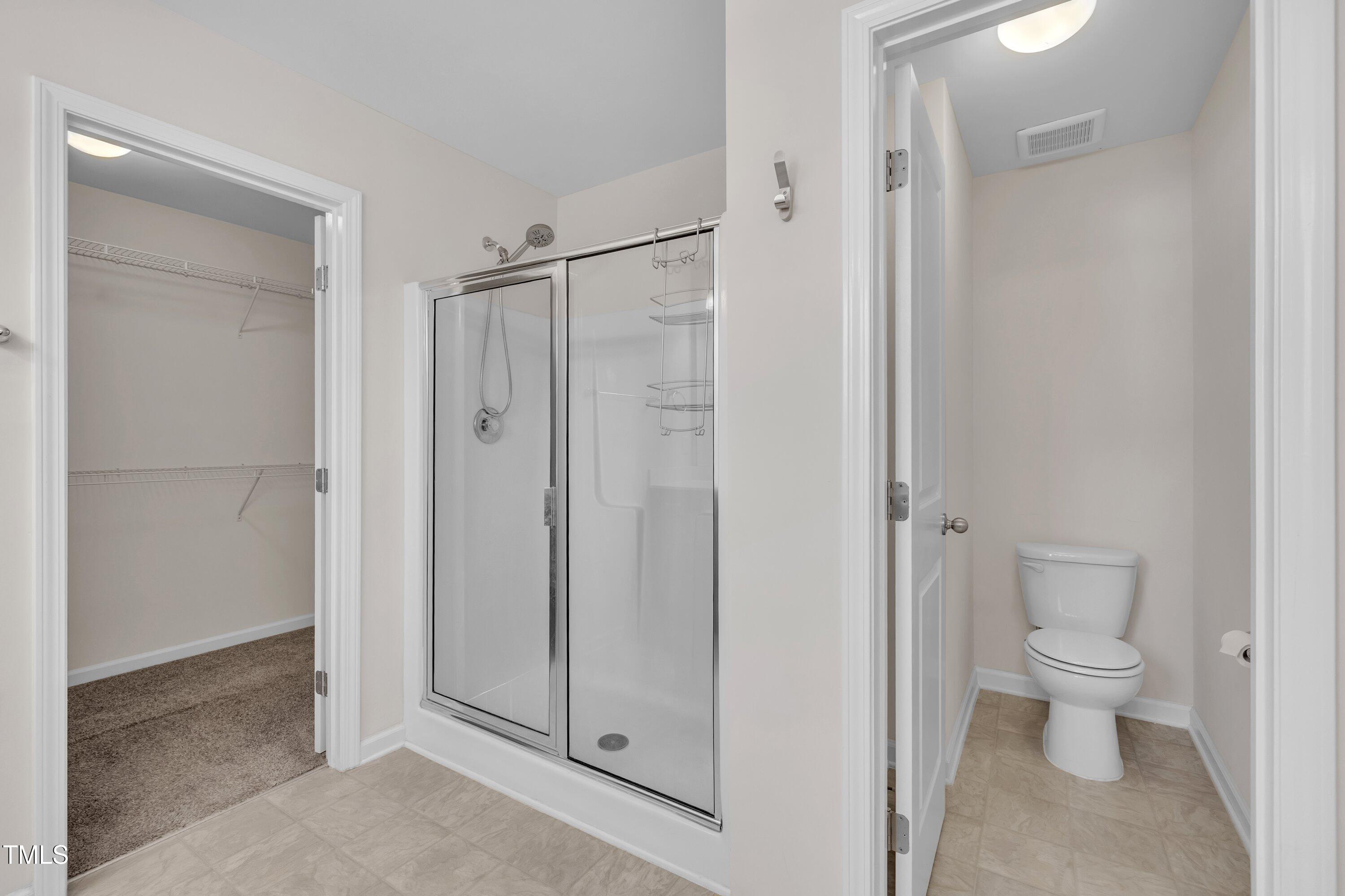 3519 Winding Walk Court Raleigh, NC 27616 - Photo 21 of 43 a bathroom view of a toilet and a shower