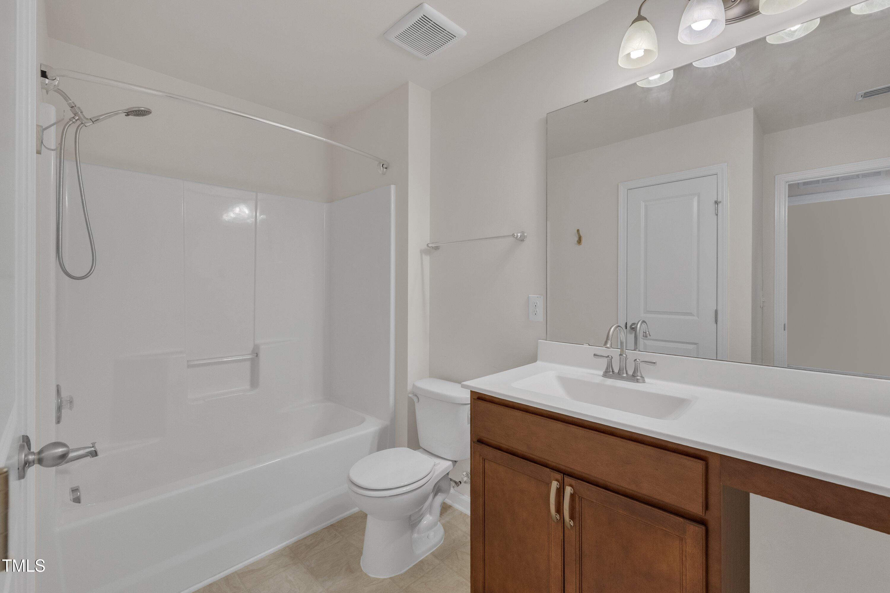 3519 Winding Walk Court Raleigh, NC 27616 - Photo 25 of 43 a bathroom with a sink a toilet and shower