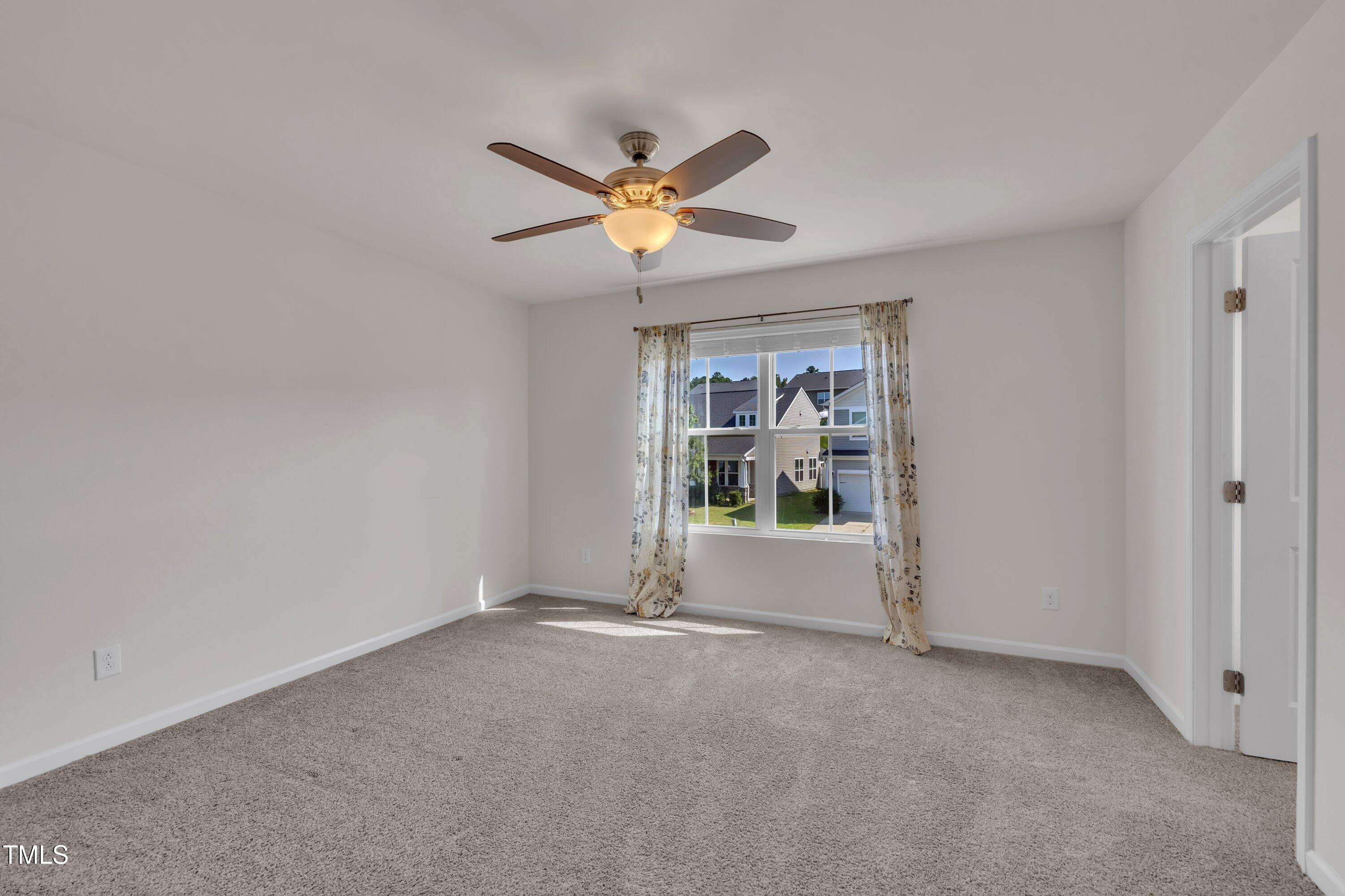 3519 Winding Walk Court Raleigh, NC 27616 - Photo 28 of 43 a view of room with window and ceiling fan