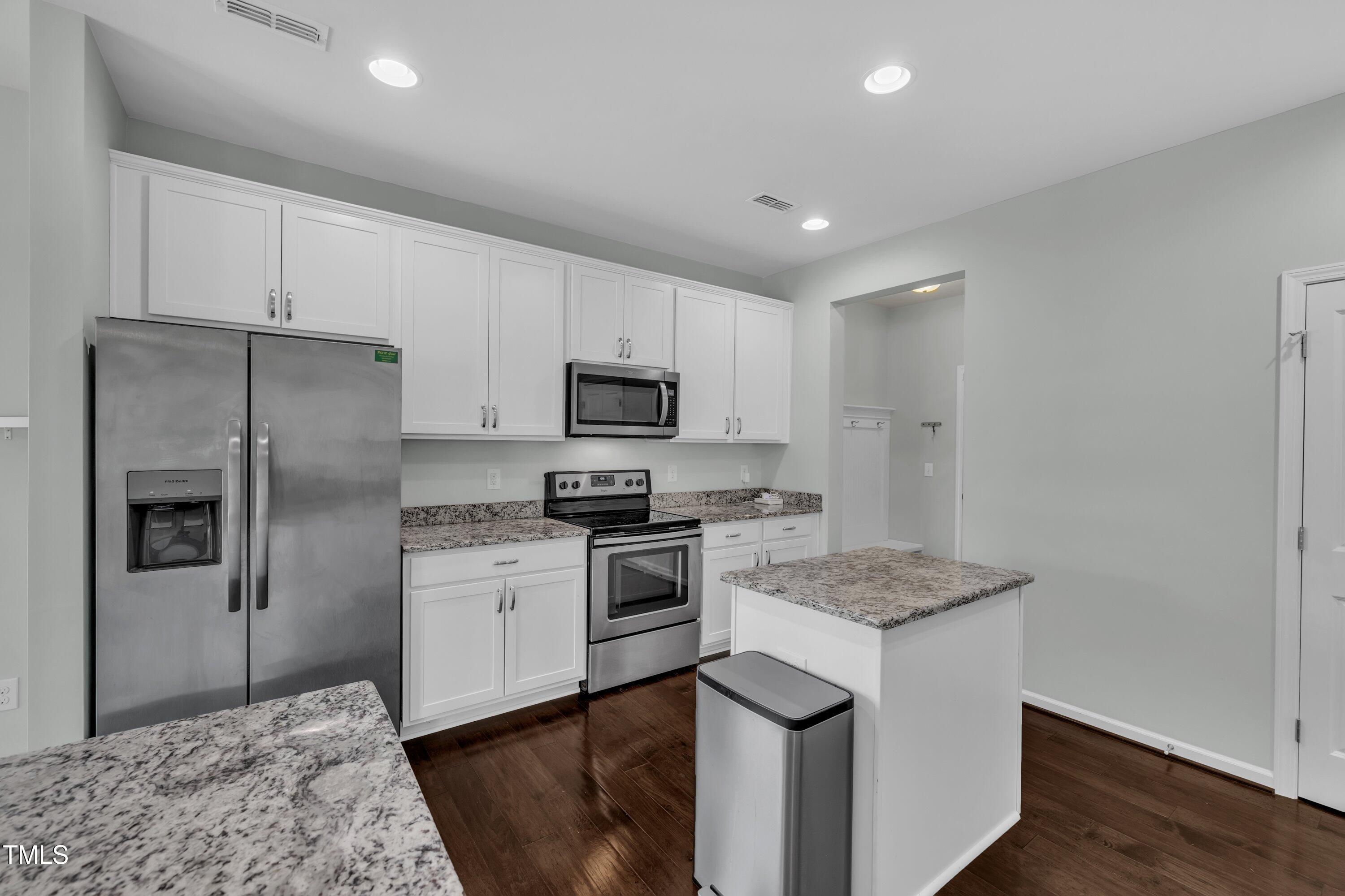 3519 Winding Walk Court Raleigh, NC 27616 - Photo 5 of 43 a kitchen with a refrigerator stove and sink