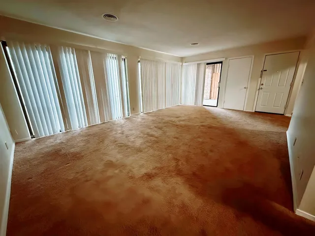 a view of a room with a fireplace