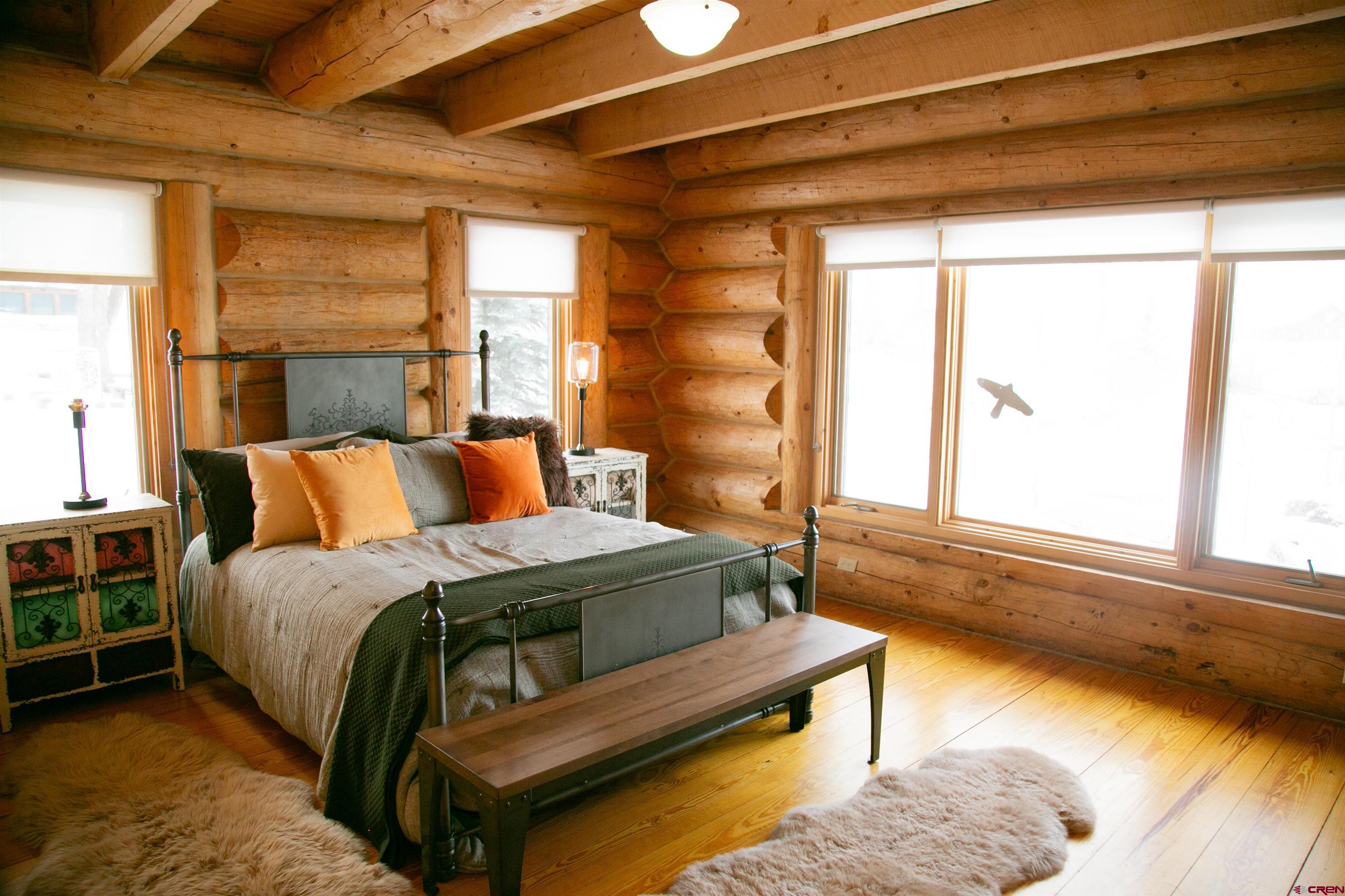 2250 Middle Creek Road Creede, CO 81130 - Photo 11 of 35 a bedroom with furniture and a large window