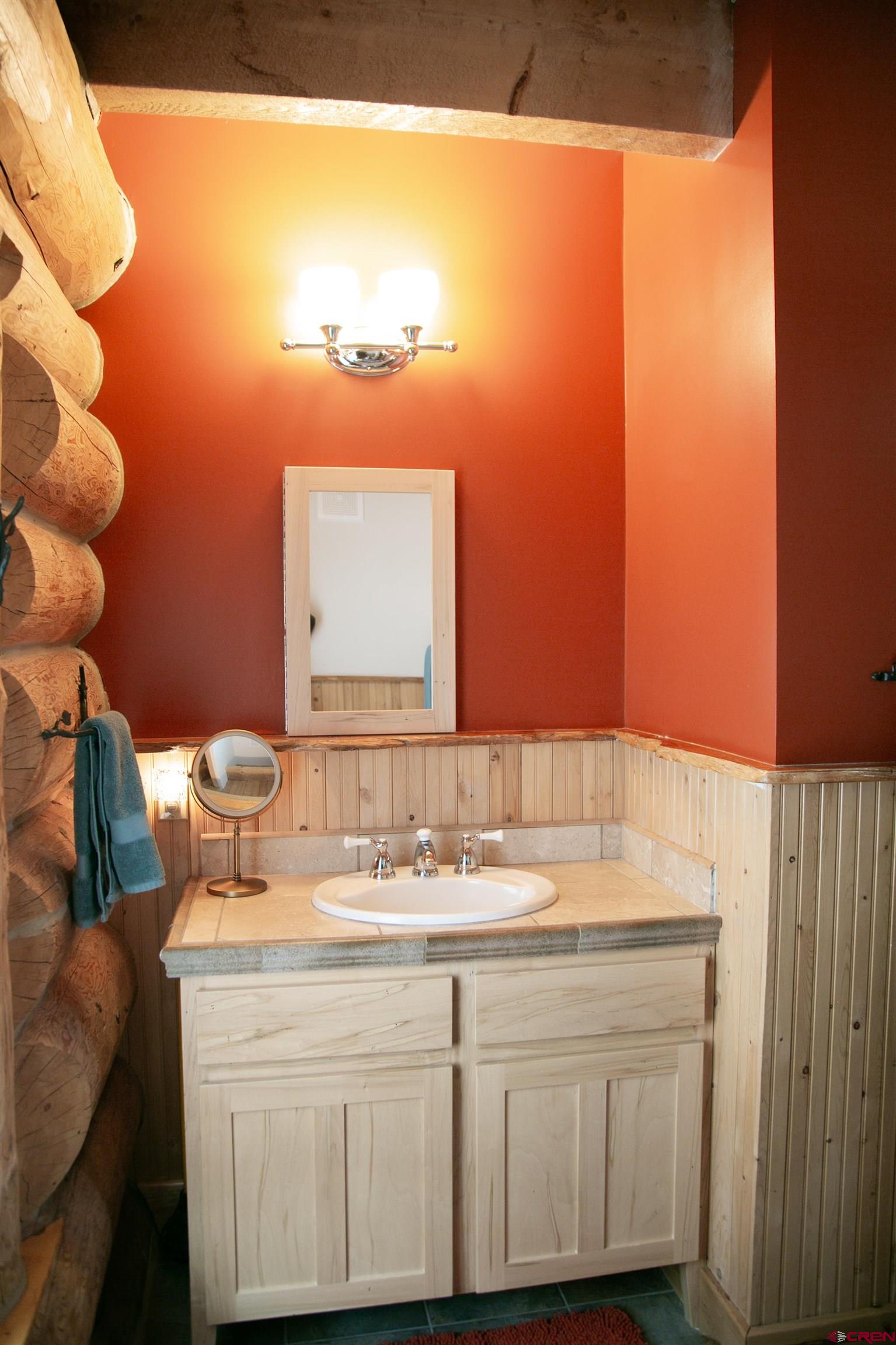 2250 Middle Creek Road Creede, CO 81130 - Photo 13 of 35 a bathroom with a sink and a mirror