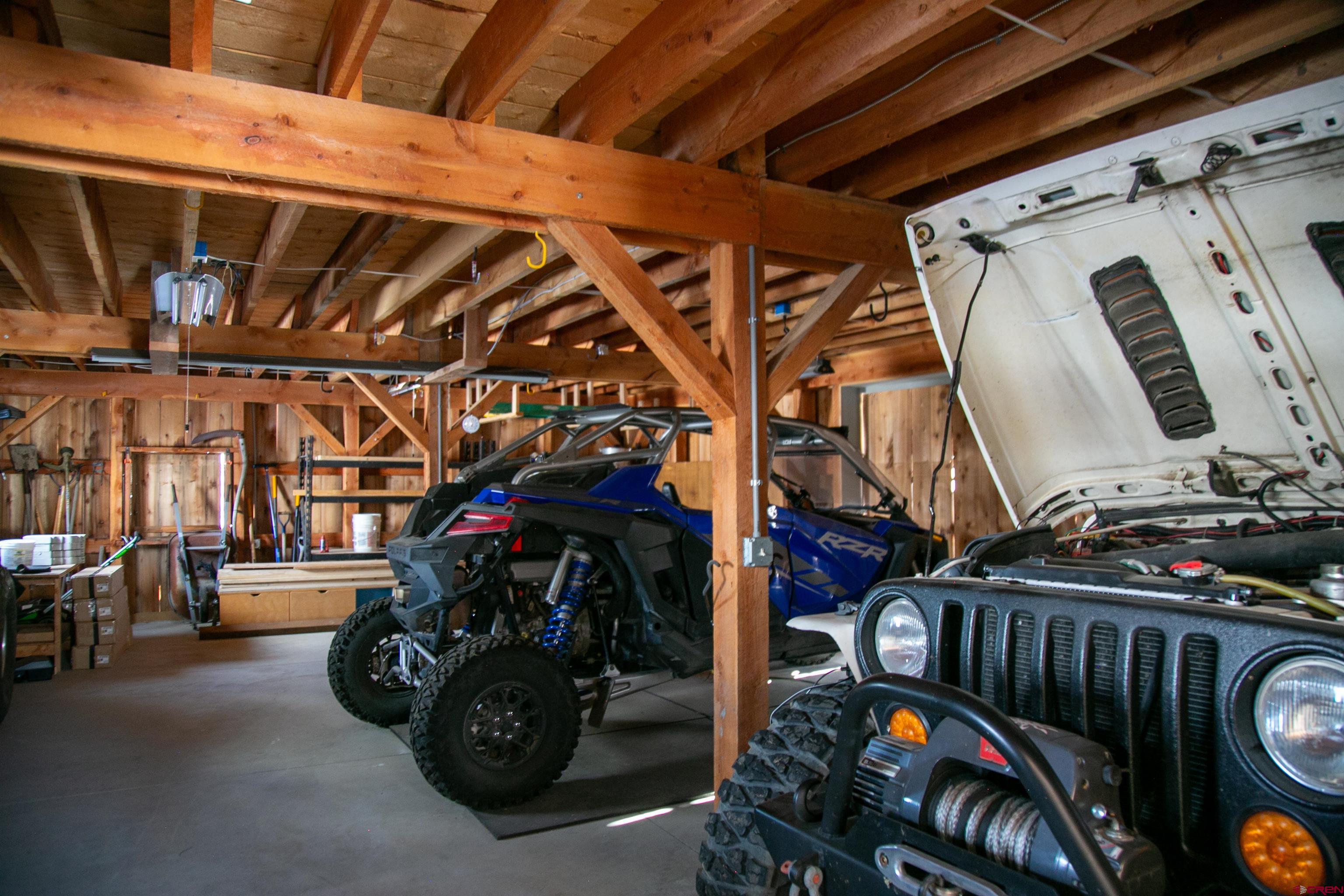 2250 Middle Creek Road Creede, CO 81130 - Photo 32 of 35 a view of a garage with cars