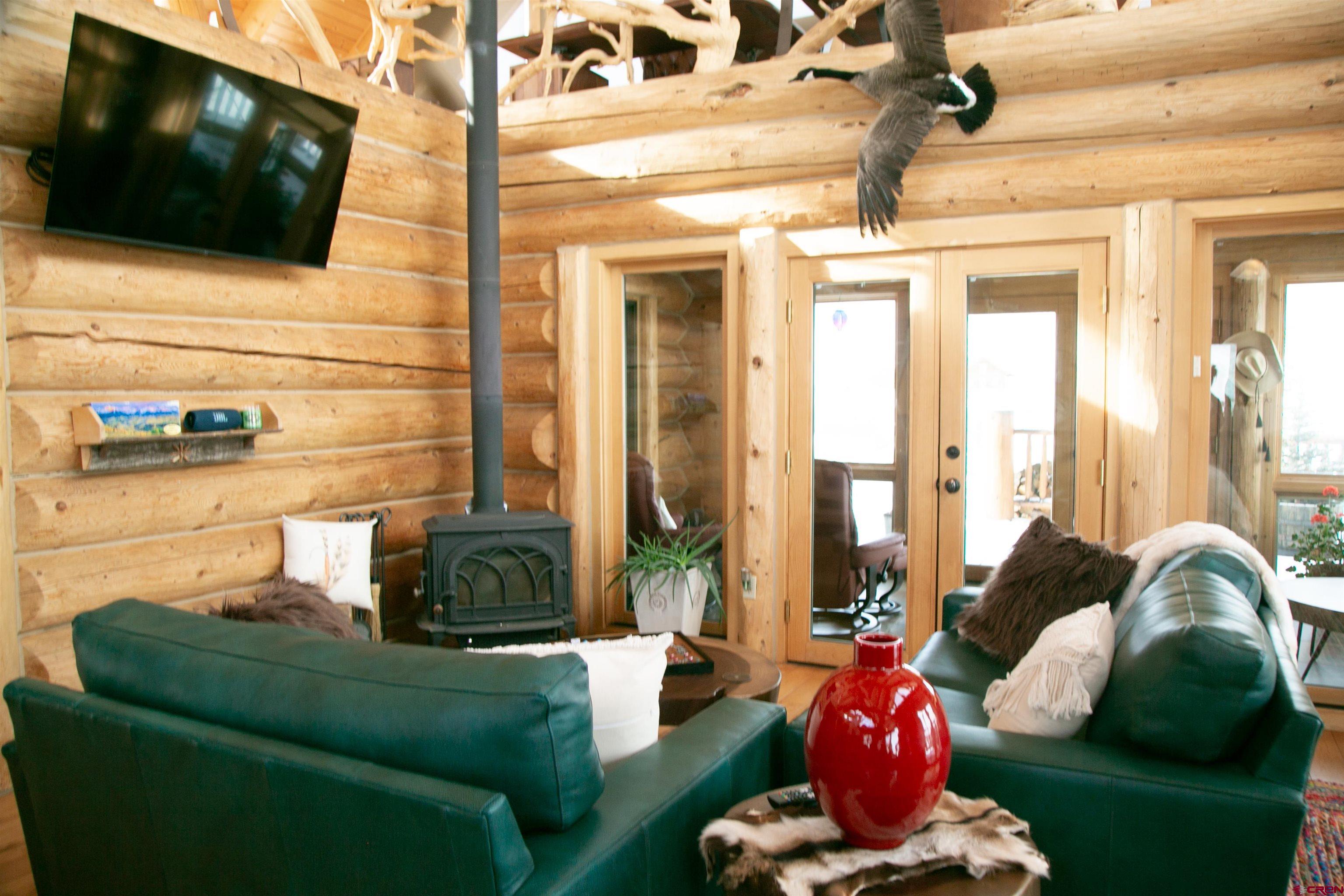 2250 Middle Creek Road Creede, CO 81130 - Photo 5 of 35 a living room with furniture and a flat screen tv