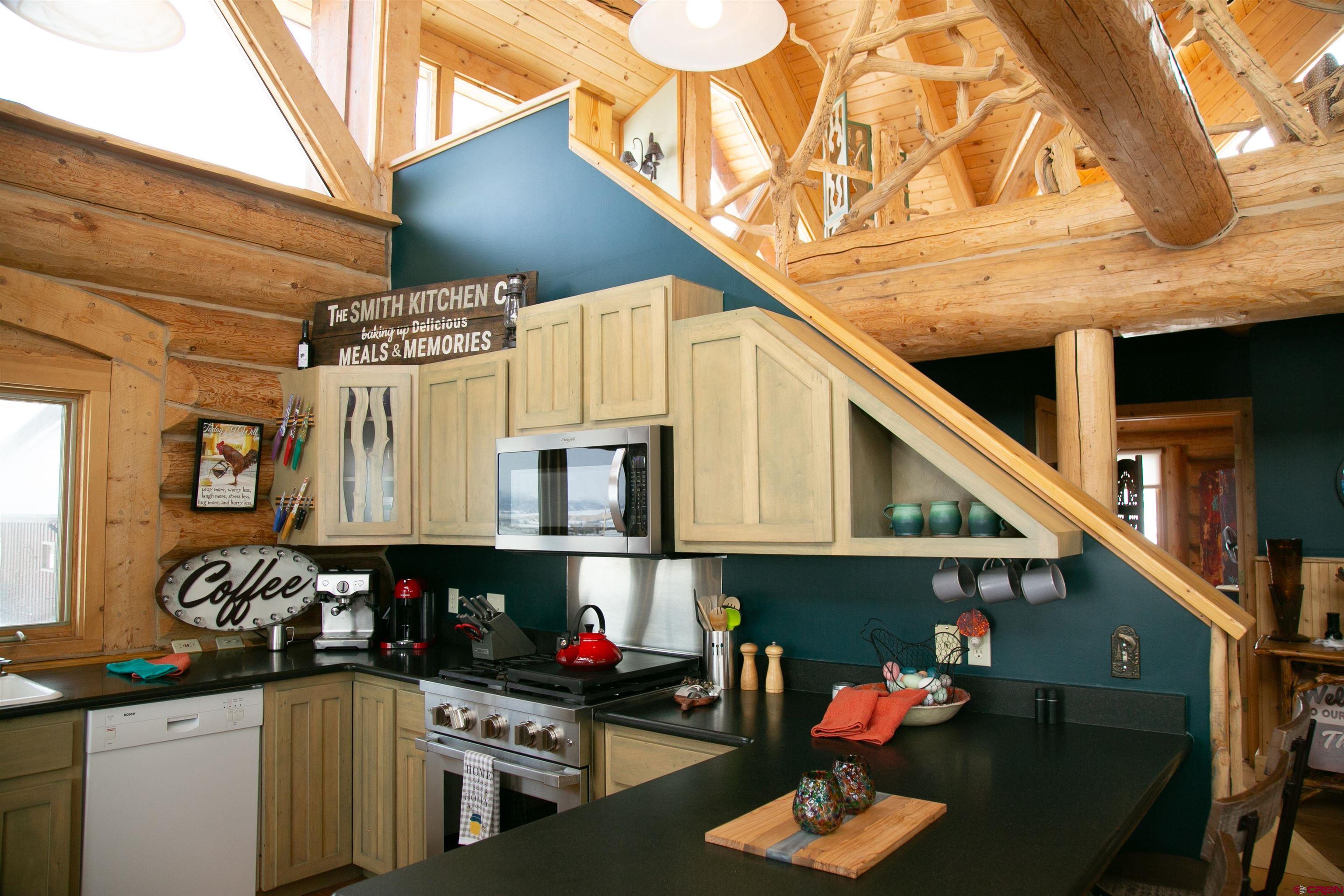 2250 Middle Creek Road Creede, CO 81130 - Photo 6 of 35 a kitchen with stainless steel appliances granite countertop a stove and cabinets