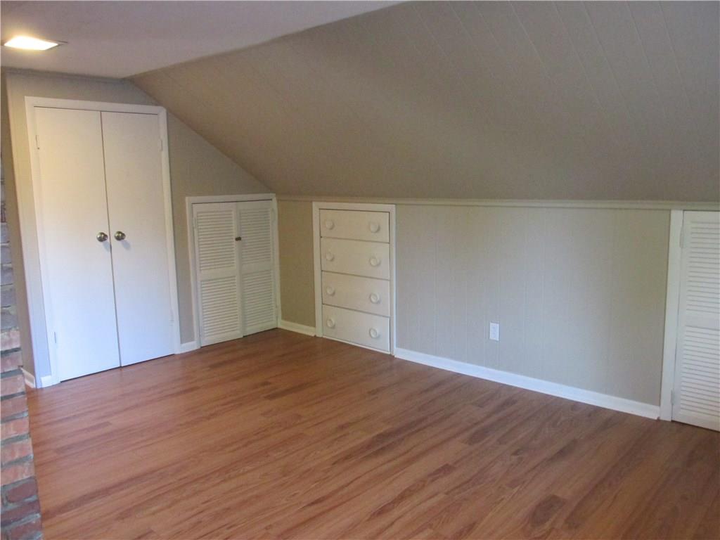180 Easton Road Hermitage, PA 16148 - Photo 22 of 25 Another view of the 4th Upper Bedroom showing the closet and the built-in's for Storage! New Flooring...