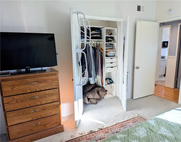 a lobby with furniture and potted plant