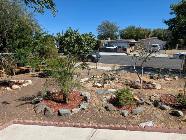 a living room with furniture a rug and a window