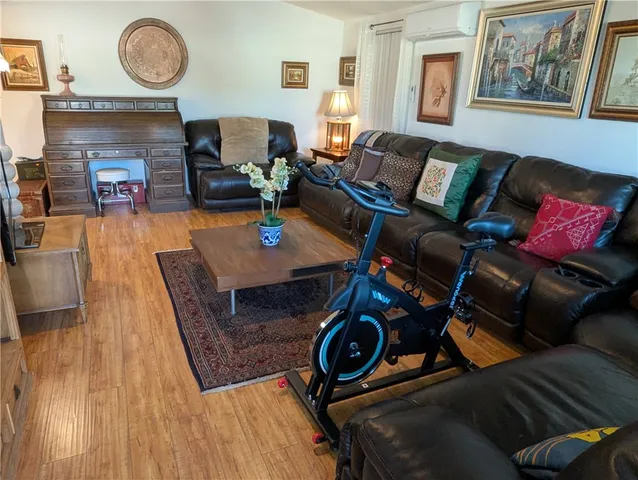 a kitchen with stainless steel appliances a sink a stove a refrigerator and cabinets