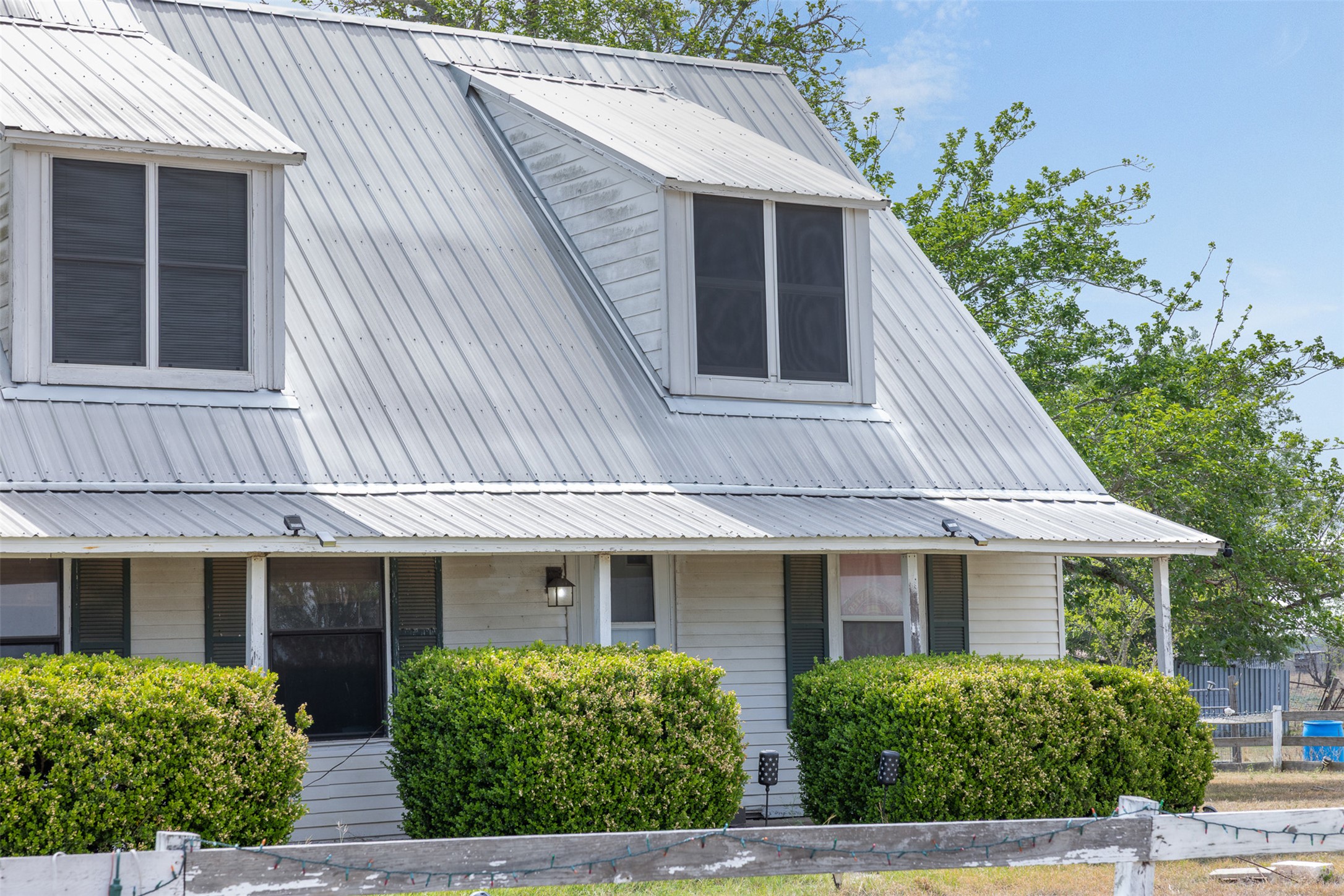 763 Upper Elgin River Road Elgin, TX 78621 - Photo 12 of 40 View of side of home featuring a metal roof