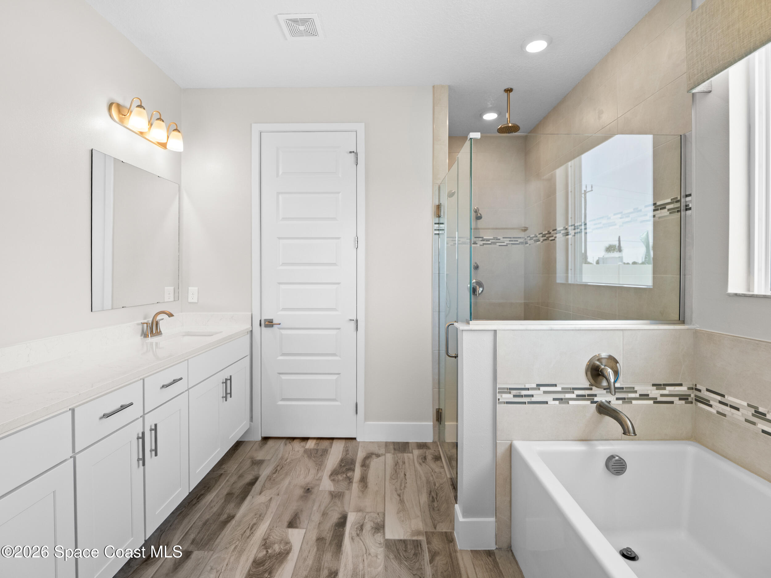 27 Gulfstream Way Satellite Beach, FL 32937 - Photo 15 of 26 a bathroom with a sink and a bathtub