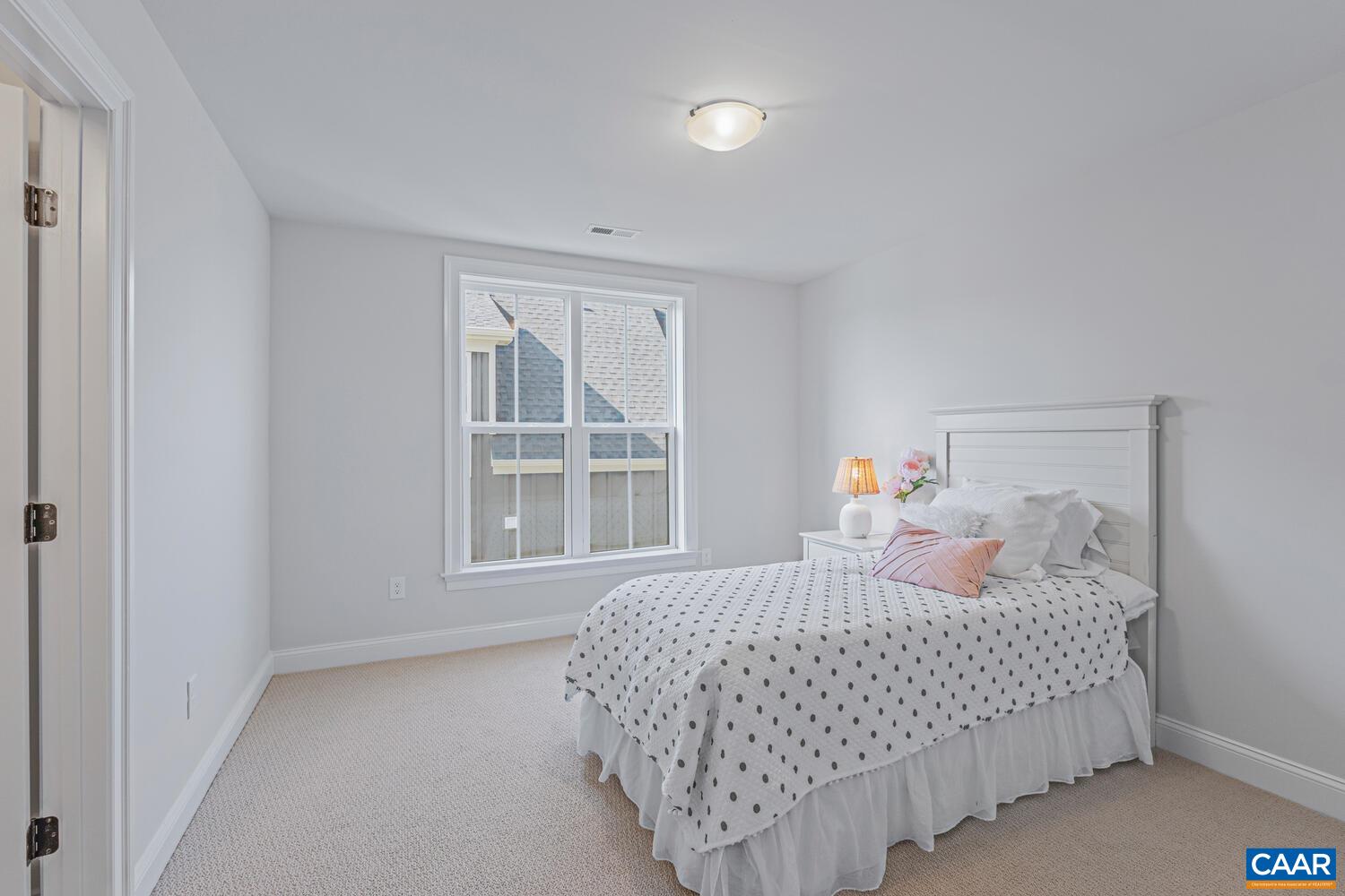 1731 Fowler Street Charlottesville, VA 22901 - Photo 33 of 45 a bedroom with a bed and a window