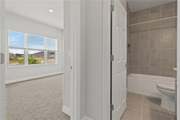 a bathroom with a sink a toilet and a bathtub