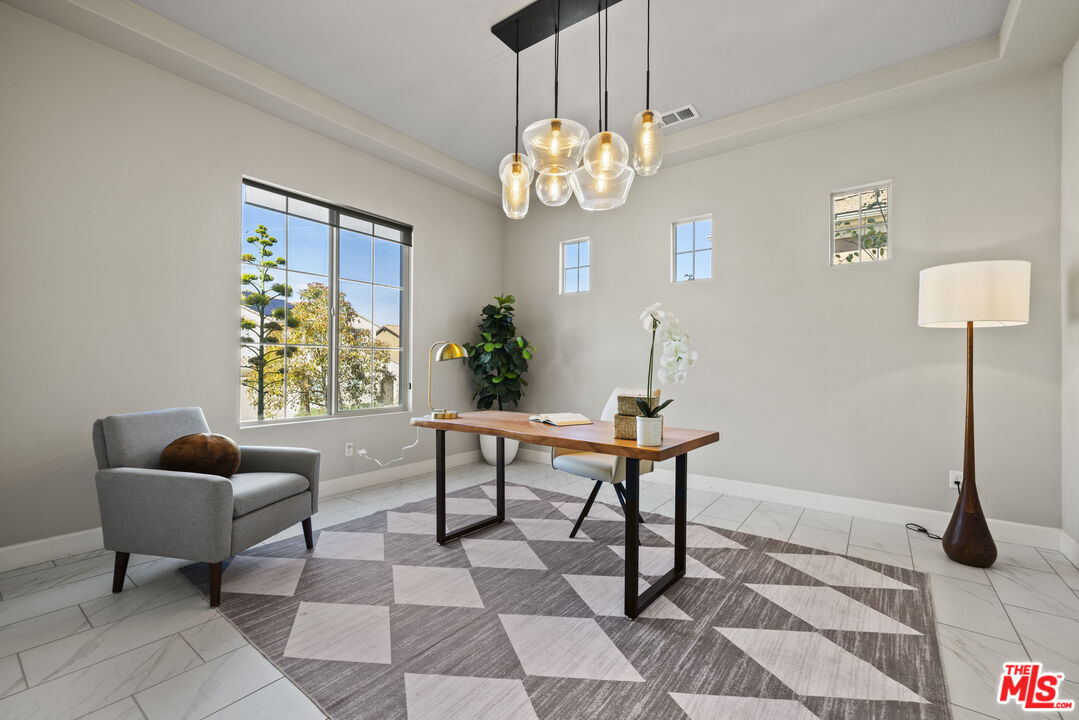 24220 Sterling Ranch Road West Hills, CA 91304 - Photo 11 of 39 a view of a dining room with furniture and chandelier