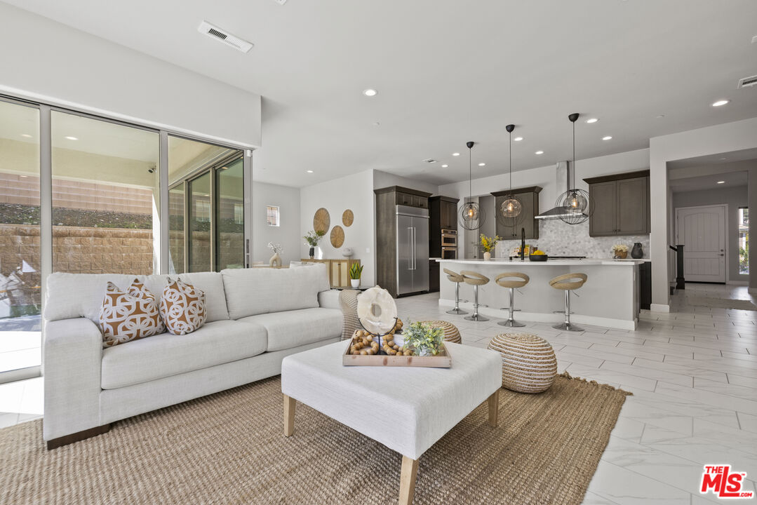 24220 Sterling Ranch Road West Hills, CA 91304 - Photo 15 of 39 a living room with furniture and view of kitchen