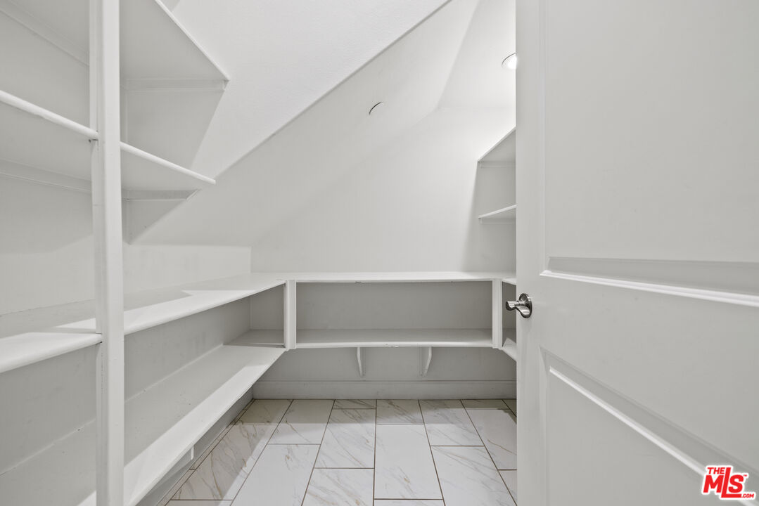 24220 Sterling Ranch Road West Hills, CA 91304 - Photo 16 of 39 a view of an empty walk in closet