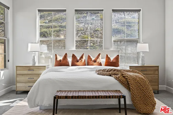a bedroom with a bed and window