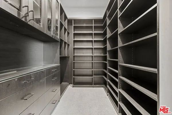 a view of an empty walk in closet