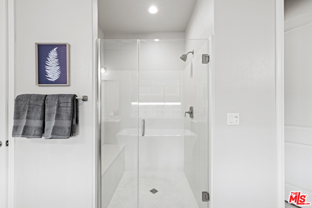 24220 Sterling Ranch Road West Hills, CA 91304 - Photo 22 of 39 a bathroom with a shower