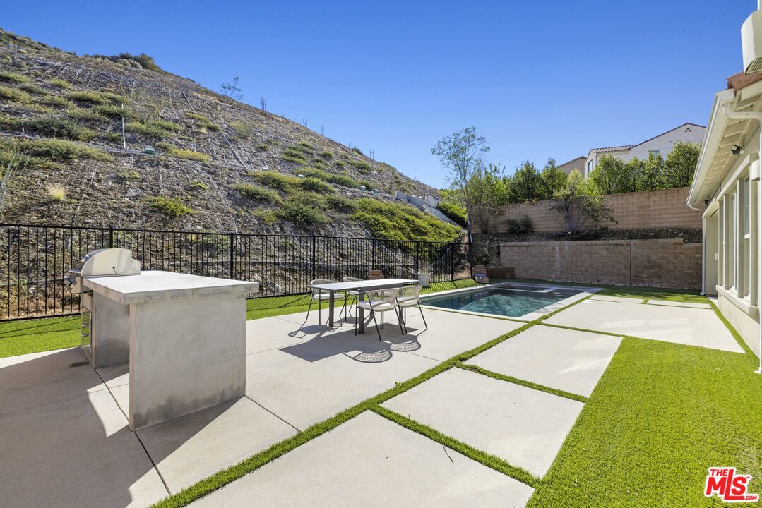 24220 Sterling Ranch Road West Hills, CA 91304 - Photo 36 of 39 a view of a swimming pool with a patio